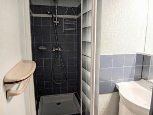a bathroom with a shower with a toilet and a sink at Apartment Les Roches Bleues-2 by Interhome in Collioure