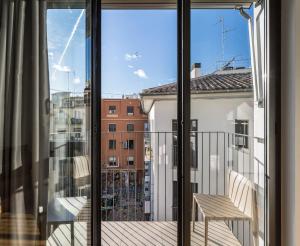 a view through a window of a building at Mon Suites Catedral in Valencia