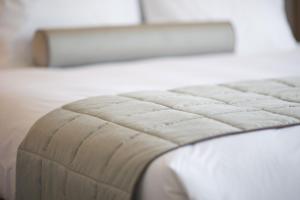 Postel nebo postele na pokoji v ubytování Magic Hotel