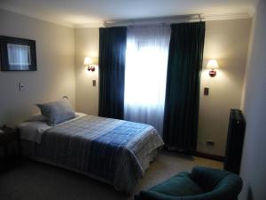 Krevet ili kreveti u jedinici u okviru objekta Hotel Isla Rey Jorge