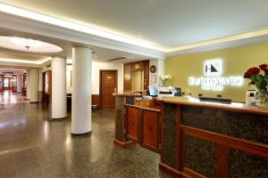 a lobby of a hospital with a reception desk at Eurostars Montgomery in Brussels