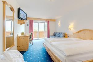 Postel nebo postele na pokoji v ubytování Hotel Piccolo