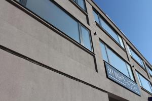 a street sign on the side of a building at Sky Nights Hotel London Heathrow in Hillingdon