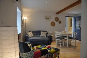 a living room with a couch and a table at Apartment Gordana in Cres