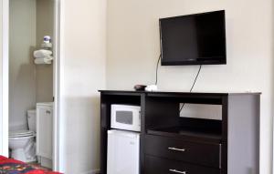Kuchyň nebo kuchyňský kout v ubytování Andrews Motor Inn