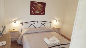 Letto o letti in una camera di Apartment Conchiglie
