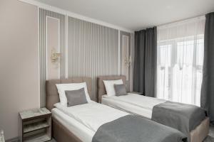 Postel nebo postele na pokoji v ubytování Mon Ami Hotel