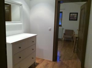 a bathroom with a dresser and a mirror at Zwischen Mozart und König Ludwig in Teisendorf +26 photos