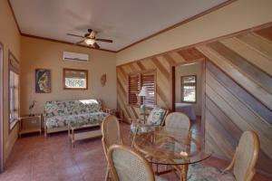 a living room with a table and chairs and a couch at X'tan Ha- The Waterfront in San Pedro