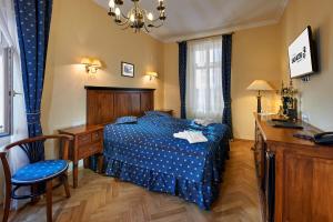 Ein Bett oder Betten in einem Zimmer der Unterkunft Salvator Hotel