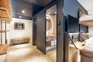 H2 Hotel München Olympiapark客房内的一张或多张床位