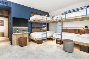 H2 Hotel München Olympiapark客房内的一张或多张床位