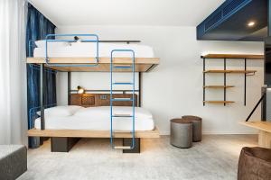H2 Hotel München Olympiapark客房内的一张或多张床位