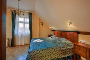 Ein Bett oder Betten in einem Zimmer der Unterkunft Salvator Hotel