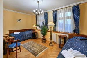 Ein Bett oder Betten in einem Zimmer der Unterkunft Salvator Hotel