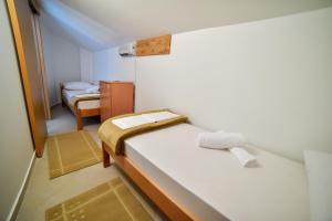 Postel nebo postele na pokoji v ubytování Hostel Sinj