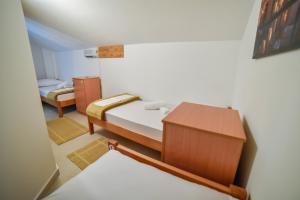 Postel nebo postele na pokoji v ubytování Hostel Sinj