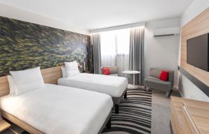 Cama ou camas em um quarto em Novotel Blois Centre Val De Loire