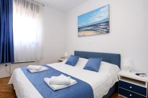 Rúm í herbergi á Luxury Apartment ELA