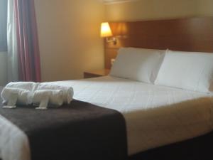 Кровать или кровати в номере Hotel Avión by Bossh! Hotels
