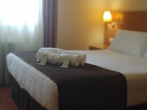 Кровать или кровати в номере Hotel Avión by Bossh! Hotels