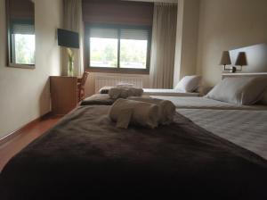 Кровать или кровати в номере Hotel Avión by Bossh! Hotels