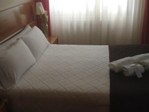Кровать или кровати в номере Hotel Avión by Bossh! Hotels