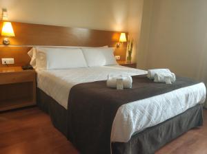 Кровать или кровати в номере Hotel Avión by Bossh! Hotels