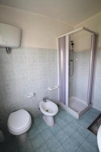 a bathroom with a toilet and a shower at Casa vacanze Teresa in Capo Vaticano +39 photos