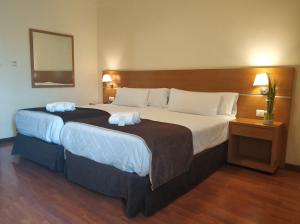 Кровать или кровати в номере Hotel Avión by Bossh! Hotels