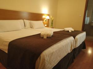 Кровать или кровати в номере Hotel Avión by Bossh! Hotels