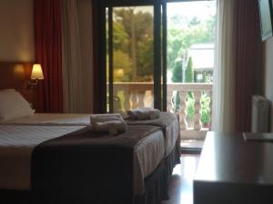 Кровать или кровати в номере Hotel Avión by Bossh! Hotels