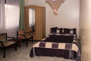 Postel nebo postele na pokoji v ubytování Hotel Millenium Kampala Zaana