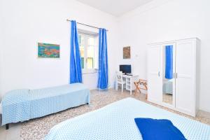 Łóżko lub łóżka w pokoju w obiekcie Villa Panoramica - Ischia Ponte