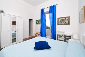 Łóżko lub łóżka w pokoju w obiekcie Villa Panoramica - Ischia Ponte