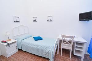Łóżko lub łóżka w pokoju w obiekcie Villa Panoramica - Ischia Ponte