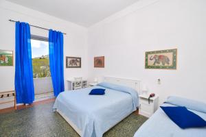 Łóżko lub łóżka w pokoju w obiekcie Villa Panoramica - Ischia Ponte