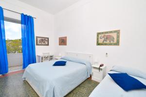 Łóżko lub łóżka w pokoju w obiekcie Villa Panoramica - Ischia Ponte