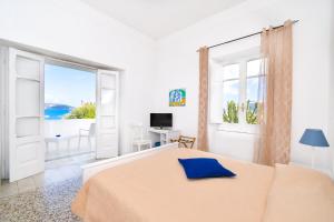 Łóżko lub łóżka w pokoju w obiekcie Villa Panoramica - Ischia Ponte