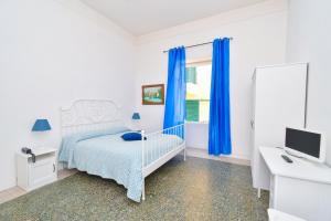 Łóżko lub łóżka w pokoju w obiekcie Villa Panoramica - Ischia Ponte