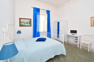 Łóżko lub łóżka w pokoju w obiekcie Villa Panoramica - Ischia Ponte