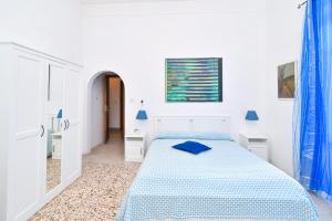 Łóżko lub łóżka w pokoju w obiekcie Villa Panoramica - Ischia Ponte