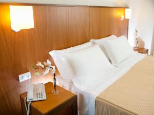 A bed or beds in a room at Park Hotel Centro Congressi