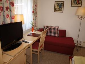 Telewizja i/lub zestaw kina domowego w obiekcie Hotel-Restaurant Burgblick