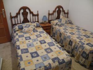 Un pat sau paturi într-o cameră la Kennedy 1 - Fincas Arena +25 fotografii