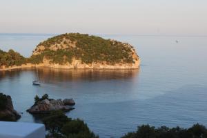 a small island in the middle of the water at Mando Beachfront in Stafylos