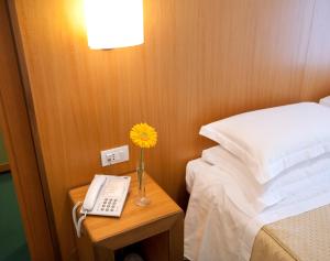 A bed or beds in a room at Park Hotel Centro Congressi