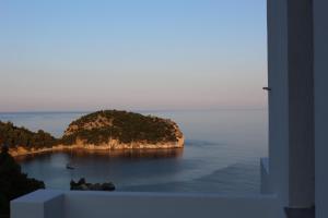 a small island in the middle of the ocean at Mando Beachfront in Stafylos