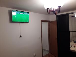 a flat screen tv on the wall of a room at Apartments Zambratija in Zambratija