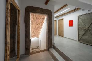 A bed or beds in a room at Barbakan